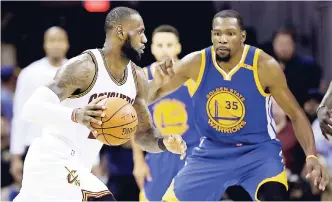  ??  ?? In this June 9, 2017, file photo, Cleveland Cavaliers forward LeBron James (23) drives on Golden State Warriors forward Kevin Durant (35) during the second half of Game 4 of basketball’s NBA Finals in Cleveland.