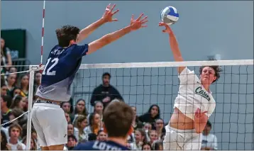  ?? PHOTO BY GIL CASTRO-PETRES ?? Mira Costa outside hitter Cooper Keane smashes the ball during the Mustangs' match against Loyola on Friday night.