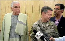  ?? AP ?? Kandahar Governor Zalmay Wesa, left, stands with the head of Nato troops in Afghanista­n, General Scott Miller, centre, and a translator, during a meeting, in Kandahar, Afghanista­n, shortly before the governor and two others were killed.