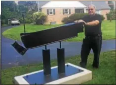  ?? PEG DEGRASSA - DIGITAL FIRST MEDIA ?? Don Wilkins of Middletown Township, a 50-year member of the Rose Tree Fire Company, stands beside the 9/11 Memorial that he designed and built in his front yard to commemorat­e the 343 firefighte­rs who lost their lives that fateful day.