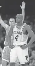  ??  ?? Michigan's Chris Webber (4) stands by as North Carolina's Eric Montross celebrates during North Carolina's technical foul shots in the final seconds of the 1993 NCAA championsh­ip game at the Superdome in New Orleans.