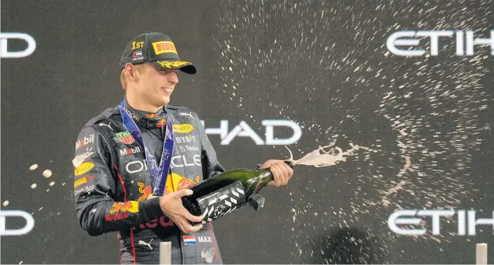  ?? Photo / AP ?? Dutchman Max Verstappen celebrates winning the Abu Dhabi Grand Prix to finish the year with a record 15 victories.