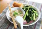  ?? COLE BURSTON/FOR THE TORONTO STAR ?? Chef Nick Liu’s meal of congee, bok choi and Chinese fried dough.