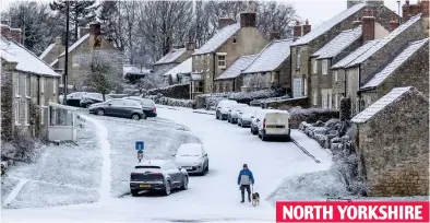  ?? ?? NORTH YORKSHIRE Flurry on home, now: Villagers take in idyllic scenes in Lockton on the North York Moors