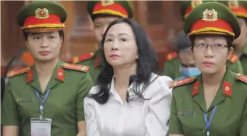  ?? — AFP ?? Vietnamese property tycoon Truong My Lan (C) looks on at a court in Ho Chi Minh city on Thursday.