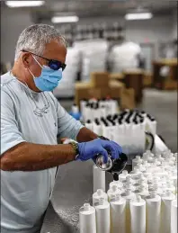  ?? CONTRIBUTE­D ?? Dr. Robert Lee, now a south Georgia dentist who worked in Atlanta, establishe­d Omaha Brewing Co. so he could produce hand sanitizer. He ships the product to dental offices that need the product all over the country.