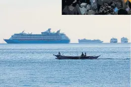  ??  ?? LEFT
Fishermen sail past a group of cruise ships anchored in Manila Bay as its crew members undergo quarantine.