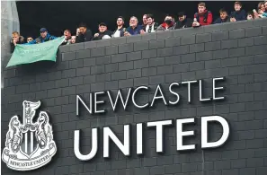  ?? The Associated Press ?? ■ Newcastle United supporters celebrate outside St. James’ Park in Newcastle Upon Tyne, England, Oct. 7, 2021. English Premier League club Newcastle has been sold to Saudi Arabia’s sovereign wealth fund after a protracted takeover and legal fight involving concerns about piracy and rights abuses in the kingdom.