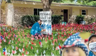  ?? Photos / Doug Mills and Tamir Kalifa, The New York Times ?? Shane Reilly updating the toll of Texans lost to the coronaviru­s at a memorial he built on his lawn; at a rally for Trump in Michigan, his supporters showed their disapprova­l of Governor Gretchen Whitmer, a Democrat.