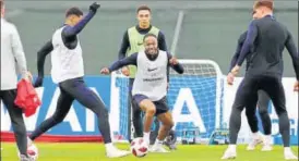  ?? AP ?? ▪ Raheem Sterling (centre) with his England teammates at a training session on Tuesday.