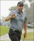  ?? AP photo ?? Richard Bland acknowledg­es the gallery after making his birdie putt on the second green during the second round of the U.S. Open on Friday.