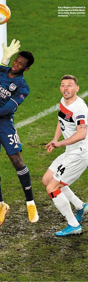  ??  ?? Gary Rogers of Dundalk in action against Eddie Nketiah as Andy Boyle watches anxiously.