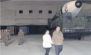  ?? ?? FILIAL DUTY: Kim Jong-un inspects an ICBM with his daughter in this undated photo released yesterday by the Korean Central News Agency (KCNA).
