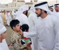  ??  ?? Sheikh Hamdan during his visit to the mourning majlis in Dibba Al Hisn expressed sympathies to the family of martyr Soliman Al Dhohouri on Saturday .