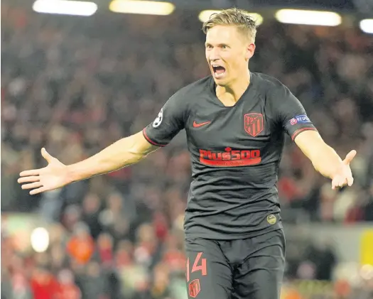  ?? AP ?? Atlético Madrid’s Marcos Llorente celebrates after scoring his side’s second goal during a second-leg, round-of-16, Champions League match between Liverpool and Atlético Madrid at Anfield stadium in Liverpool, England, yesterday. Llorente scored twice in Atléti’s 3-2 win.