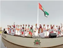  ?? Photo by M. Sajjad ?? Men performing traditiona­l dance Ayyala after the flag-hoisting ceremony at The Flag Island in Sharjah. —