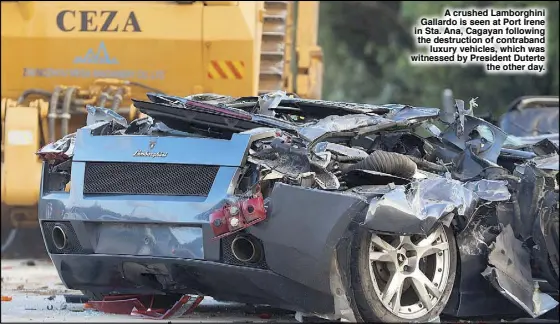  ??  ?? A crushed Lamborghin­i Gallardo is seen at Port Irene in Sta. Ana, Cagayan following the destructio­n of contraband luxury vehicles, which was witnessed by President Duterte the other day.