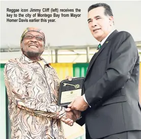  ??  ?? Reggae icon Jimmy Cliff (left) receives the key to the city of Montego Bay from Mayor Homer Davis earlier this year.