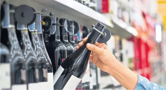  ??  ?? A survey revealed that consumers struggle to overcome the psychologi­cal £5 price barrier when it comes to buying a bottle wine.