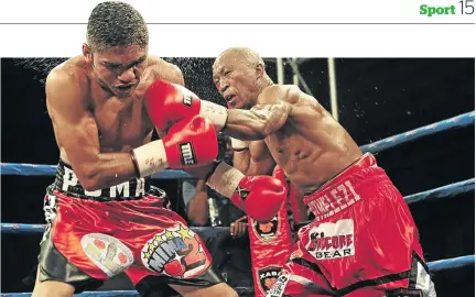  ?? / VELI NHLAPO ?? Gideon Buthelezi unleashes a punch on Angel Aviles during their recent IBO junior bantamweig­ht title fight in Kempton Park.