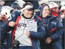  ?? ASSOCIATED PRESS FILE PHOTO ?? New England Patriots offensive coordinato­r Josh McDaniels celebrates a touchdown in front of head coach Bill Belichick, right, during their playoff games against the Tennessee Titans on Jan. 13 in Foxborough, Mass.