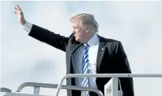  ?? ANDREW HARNIK/ AP ?? U. S. President Donald Trump boards Air Force One at Palm Beach Internatio­nal Airport in West Palm Beach, Fla., on Monday.