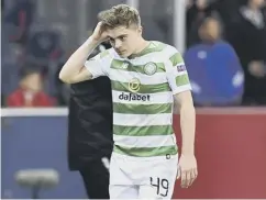  ??  ?? 0 James Forrest trudges off after seeing red in the second half.