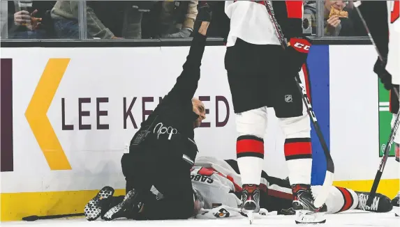  ?? BRIAN FLUHARTY-USA TODAY SPORTS ?? Medical staff attend to Senators winger Scott Sabourin, injured after a collision with Bruins’ David Backes during the game in Boston on Saturday night.