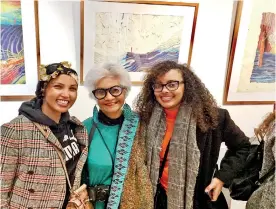  ??  ?? Anoma with two young art enthusiast­s and (bottom right) with author Romesh Gunesekera. The single small red figure in painting in the background is a reference to Greta Thunberg