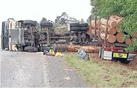  ?? Photos: TV3 ?? Carnage: The four-wheel-drive landed on its roof on the side of the road after being hit by the northbound logging truck south of Whangarei yesterday.