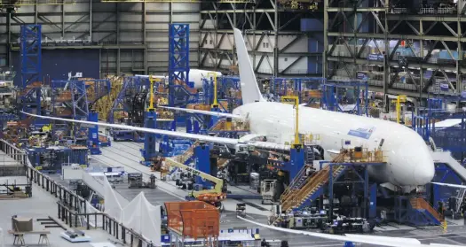  ?? Photo: Patrick T Fallon/bloomberg ?? Workers assemble a Boeing 787 Dreamliner at the factory in Everett, Washington state.