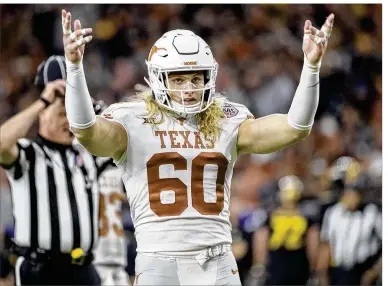  ?? RICARDO B. BRAZZIELL / AMERICAN-STATESMAN ?? Breckyn Hager, a free spirit signed by Charlie Strong but slow to catch on with Tom Herman, says he still won’t get a haircut until Texas wins the Big 12 title. He still plans on having it cut while holding the trophy.