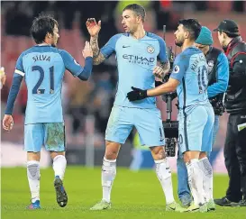  ??  ?? Sergio Aguero (right) celebrates with City team-mates Silva and Kolarov.