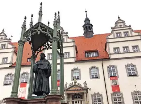  ??  ?? BIBLE-BASHING: A statue of Martin Luther looks over Wittenberg’s main Market Square. This year marks the 500th anniversar­y of Luther’s public plea that triggered the Protestant Reformatio­n.
