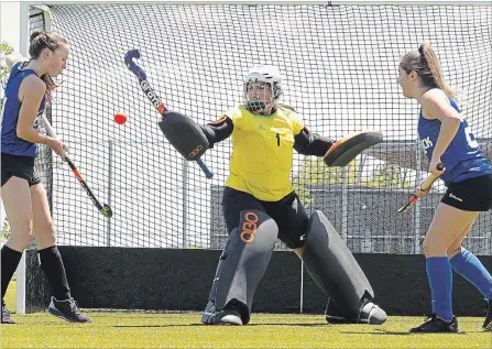  ?? CLIFFORD SKARSTEDT EXAMINER ?? Abby Hetherton of Mavericks U15/U15 Team Central Ontario, left, goalie Vanessa Markland of Mavericks U15/ U15 Team Central Ontario and Kari Lynde of Maverick sU18/U18 Team Central Ontario practise Friday at the Fleming Sports Field Complex. The trio...