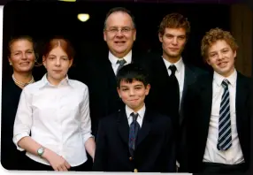  ??  ?? BOTTOM RIGHT: With wife, Marianna, and children Rosie, Johnny, Hamish and Rocco, after being sworn in as Britain’s Lord High Chancellor
in 2003.