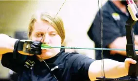  ??  ?? Starkville High School’s Cassin Gant focuses on the target during Tuesday night’s archery meet against Starkville Academy. (Photo by Chris Mcmillen, SDN)