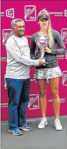  ??  ?? TROPHY TIME: KwaZulu-Natal tennis president Leonard Morgas congratula­tes Port Elizabeth’s Kaylin Bouwer on winning the Growthpoin­t Super 8 national title in Durban this month