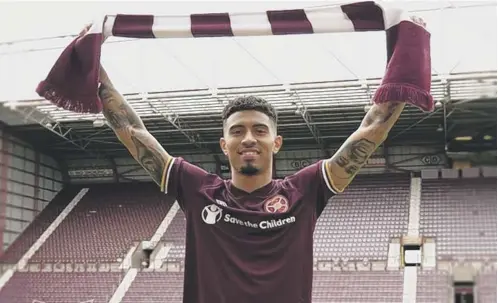  ??  ?? 0 Josh Ginnelly is unveiled at Tynecastle Park yesterday after joining Hearts on a season-long loan from Preston North End.