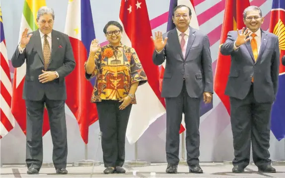  ?? Photo / AP ?? Winston Peters (left) with fellow ministers Indonesia’s Retno Marsudi, Cambodia’s Prak Sokhonn and Brunei’s Erywan Yusof in Singapore.