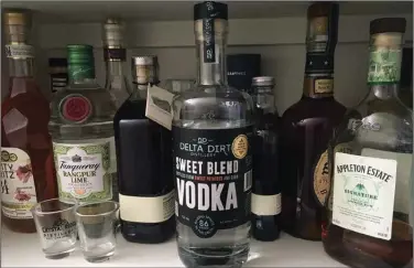  ?? (Arkansas Democrat-Gazette/Philip Martin) ?? Vodka can be made from just about anything — even sweet potatoes, as it is at Helena’s Delta Dirt Distillery.