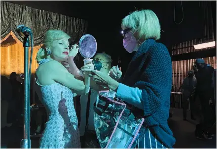  ?? ?? Linda Dowds and Stephanie Ingram creating Jessica Chastain’s look as Tammy Wynette.