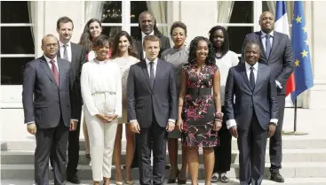  ??  ?? PARIS: French President Emmanuel Macron, center, poses with members of the new Presidenti­al Council in charge of Africa at the Elysee Palace in Paris.