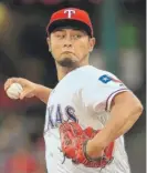  ?? | RONALD MARTINEZ/ GETTY IMAGES ?? The Dodgers dealt three minor- leaguers to the Rangers for right- hander Yu Darvish.