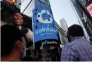  ?? Photograph: Shannon Stapleton/Reuters ?? An advert for the Nasdaq-listed cryptocurr­ency exchange Coinbase in New York.