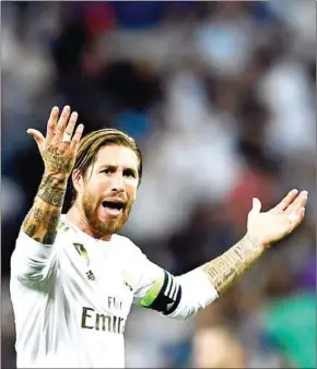  ?? AFP. ?? Sergio Ramos reacts during a match before the ban. The player has had to resort to posting videos of himself sprinting on a treadmill at home.