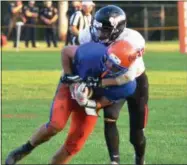  ??  ?? Oneida senior wide receiver Vinny Leibl secures a catch with a Chittenang­o defender draped all over him during a 22-14Oneida win.