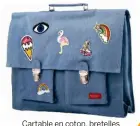  ??  ?? Cartable en coton, bretelles ajustables, poche intérieure zippée, 38 x 30 x 8 cm. Big Bretelles, Bathroomgr­affiti. com, 74,90 €.