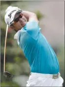  ?? The Associated Press ?? Hideki Matsuyama of Japan watches his tee shot on the second hole during the second round of the PGA Championsh­ip on Friday. He’s now tied for the lead.