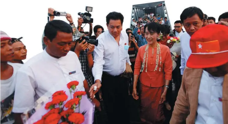  ??  ?? On the trail of change: Cynics underrate the impact of April’s by-election since even with all 48 seats the NLD would have to work within a 440-seat Parliament, but Suu Kyi has chosen to soldier soon.— Reuters